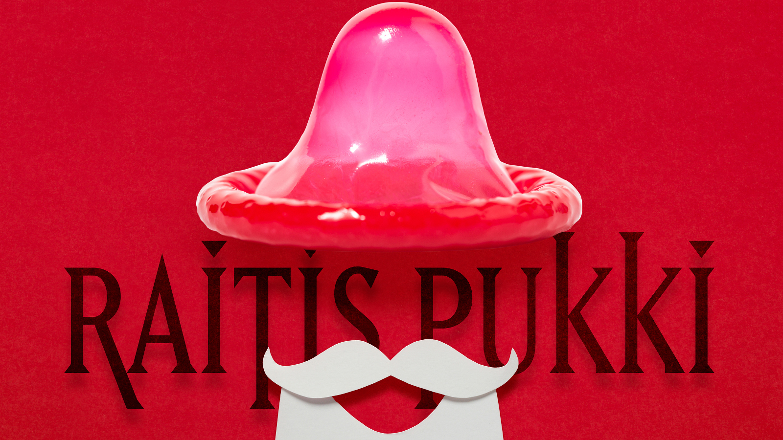 Kuvassa on punaisella pohjalla punainen hatunomainen kumilakki. Sen alla lukee Raitis pukki ja sen alla on valkoiset viikset ja partaa.