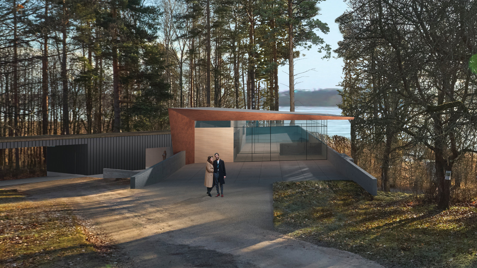 Kuvassa on metsikössä meren rannalla matala tumma, lasiseinäinen rakennus. Edessä on avaraa pihaa.