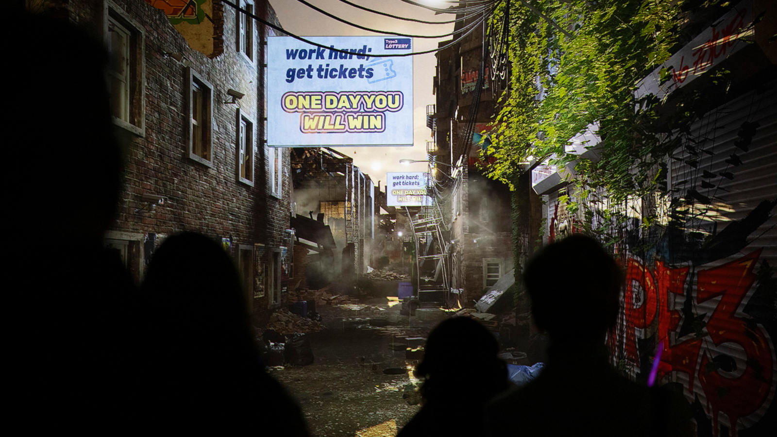 Kuvassa on tuma katunäkymä ja siinä savua ja rikkonaisia telineitä sekä kyltti, jossa lukee One day you will win.