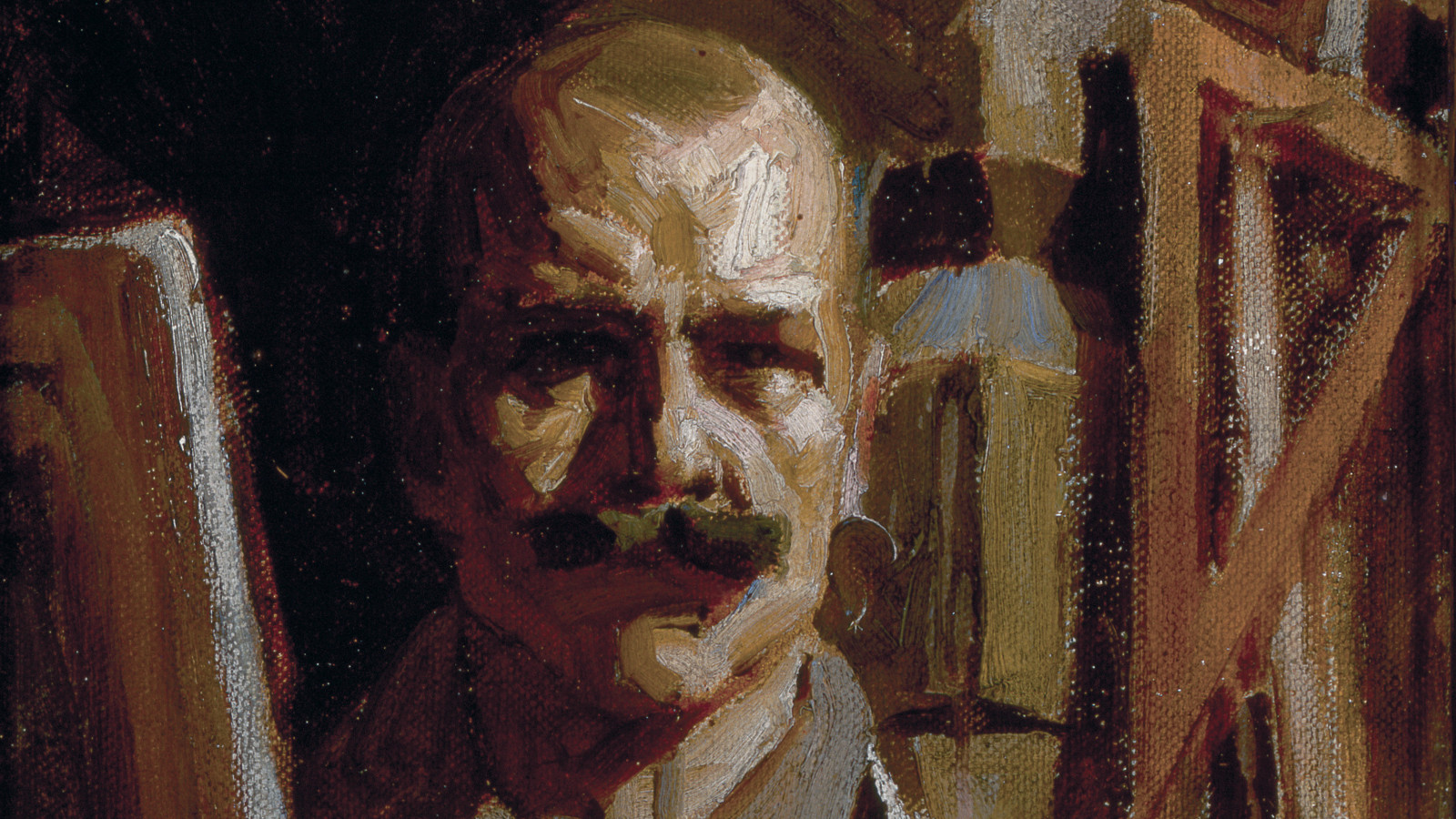 Kuvassa on Akseli Gallen-Kallelan omakuva, jossa näkyy ateljeen rakenteita. Kuva on ruskean näköinen.