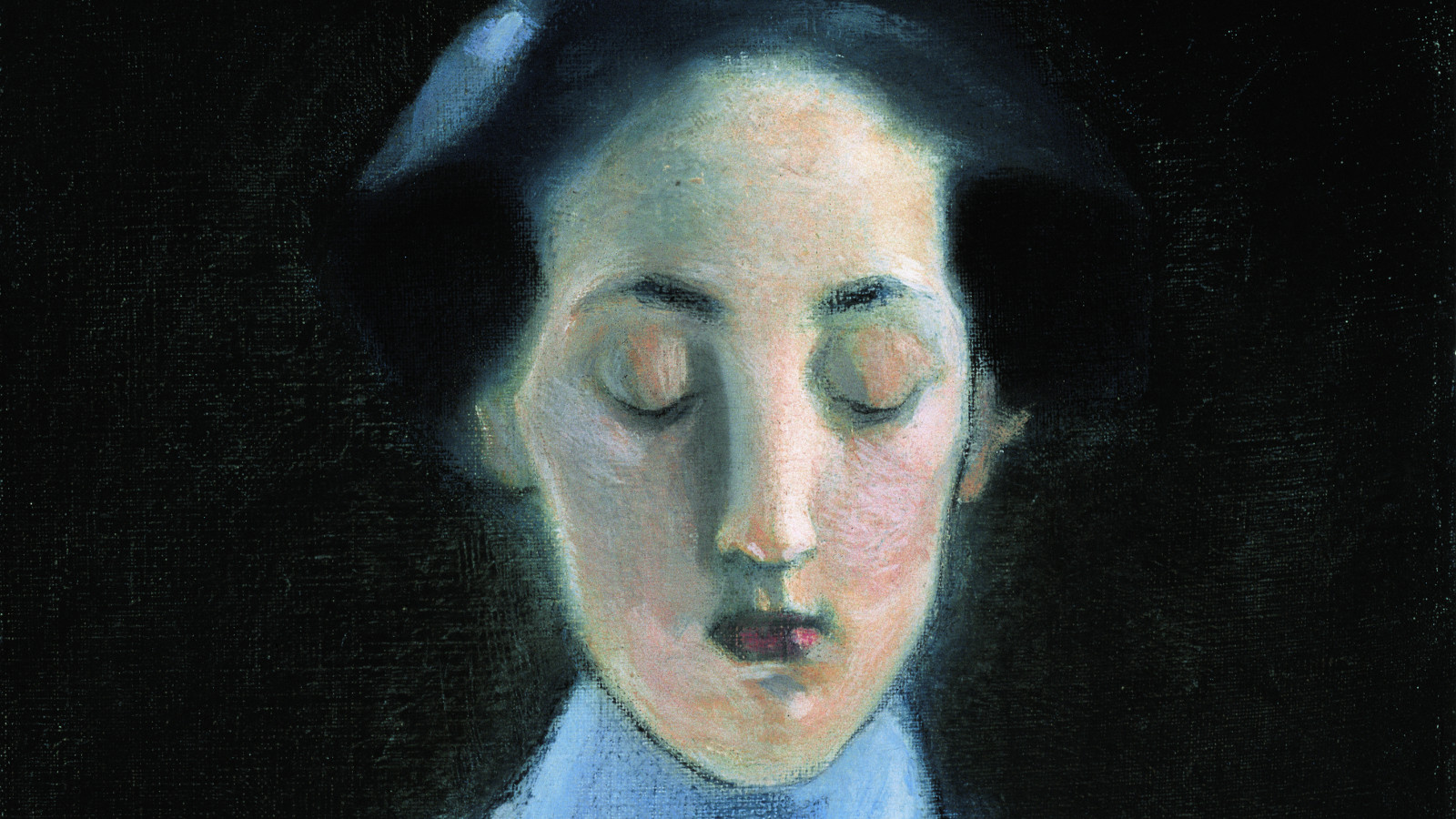 Kuvassa on Helene Schjerfbeckin kasvokuva, jossa on katse alaspäin. Hiukset ovat tummat ja tausta on tumma. 