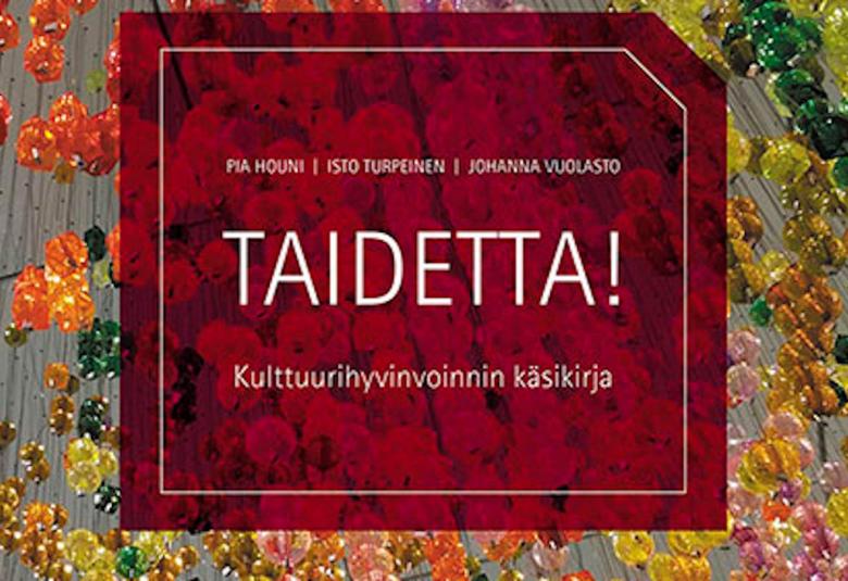 Kuvassa on taustalla pallomaisia koristeketjuja eri väreissä ja keskellä kuvaa kirjan kansi.