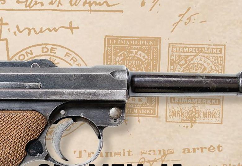 Kuvassa on pistoolin piippu ruskealla pohjalla.