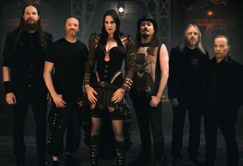 Kuvassa ovat Nightwish-bändin jäsenet yhteiskuvassa.  Kuvan sävy on tumma ja pukeutuminen on mustaa.