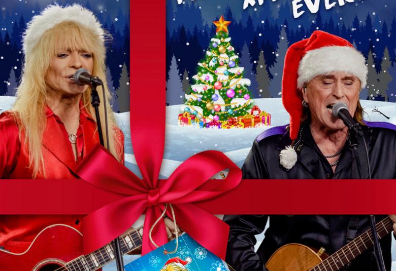 Kuvassa ovat vasemmalla Michael Monroe ja oikealla Tommi Läntinen ja he soittavat kitaraa.  Molemmilla on tonttuhatut päässään ja kuvassa menee leveä lahjanauha ristikkäin lahjapakettimaisesti ja siinä on iso rusetti.  Taustalla on lumimaisemaa.