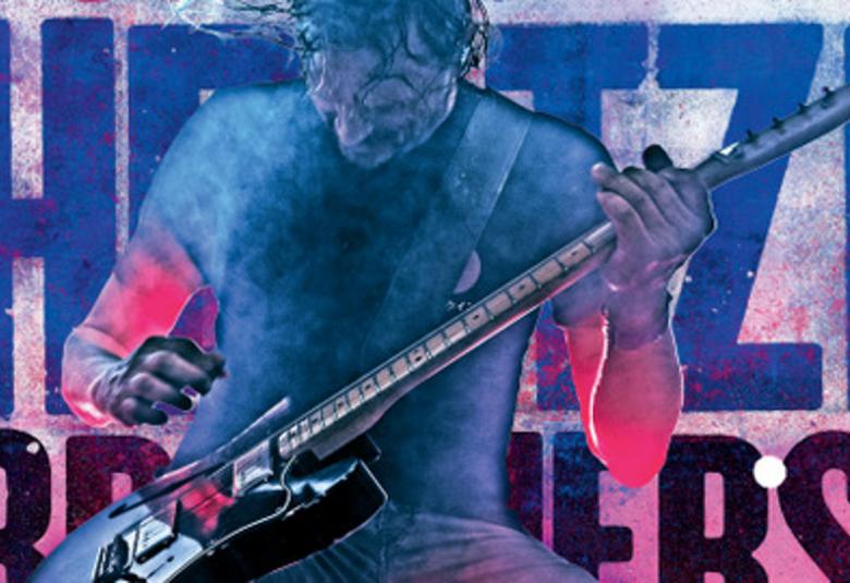 Kuvassa on osa levyn kannesta ja se on tehty akvarellivärein. Siinä on kitaristi soittamassa ja väri on sininen. Alempana on punertavaa. Soittajan hihassa on hieman punaista. Taustalla on bändin nimi.