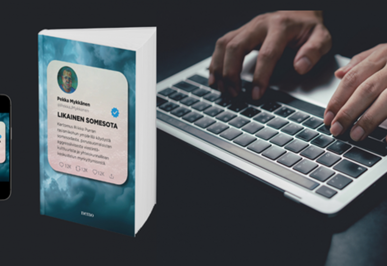 Kuvassa on tummalla taustalla pehmeäkantinen kirja pystyssä ja pieni vieessä. Oikealla on kädet läppärin näppäimillä.  